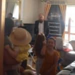 Smiling children at birthday party with magician
